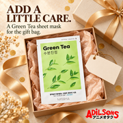 MISSHA Green Tea sheet mask arranged in a warm gold gift box.