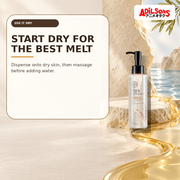 Rich cleansing oil on a dry ivory stage with water kept beyond a boundary.