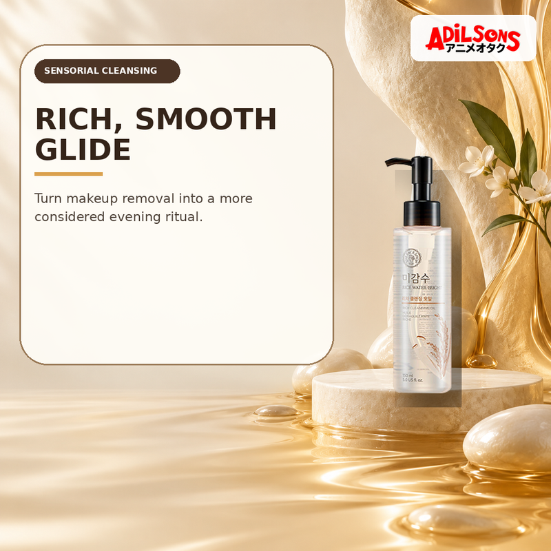 Rich cleansing oil in a soft pearl-and-amber sensorial still life.